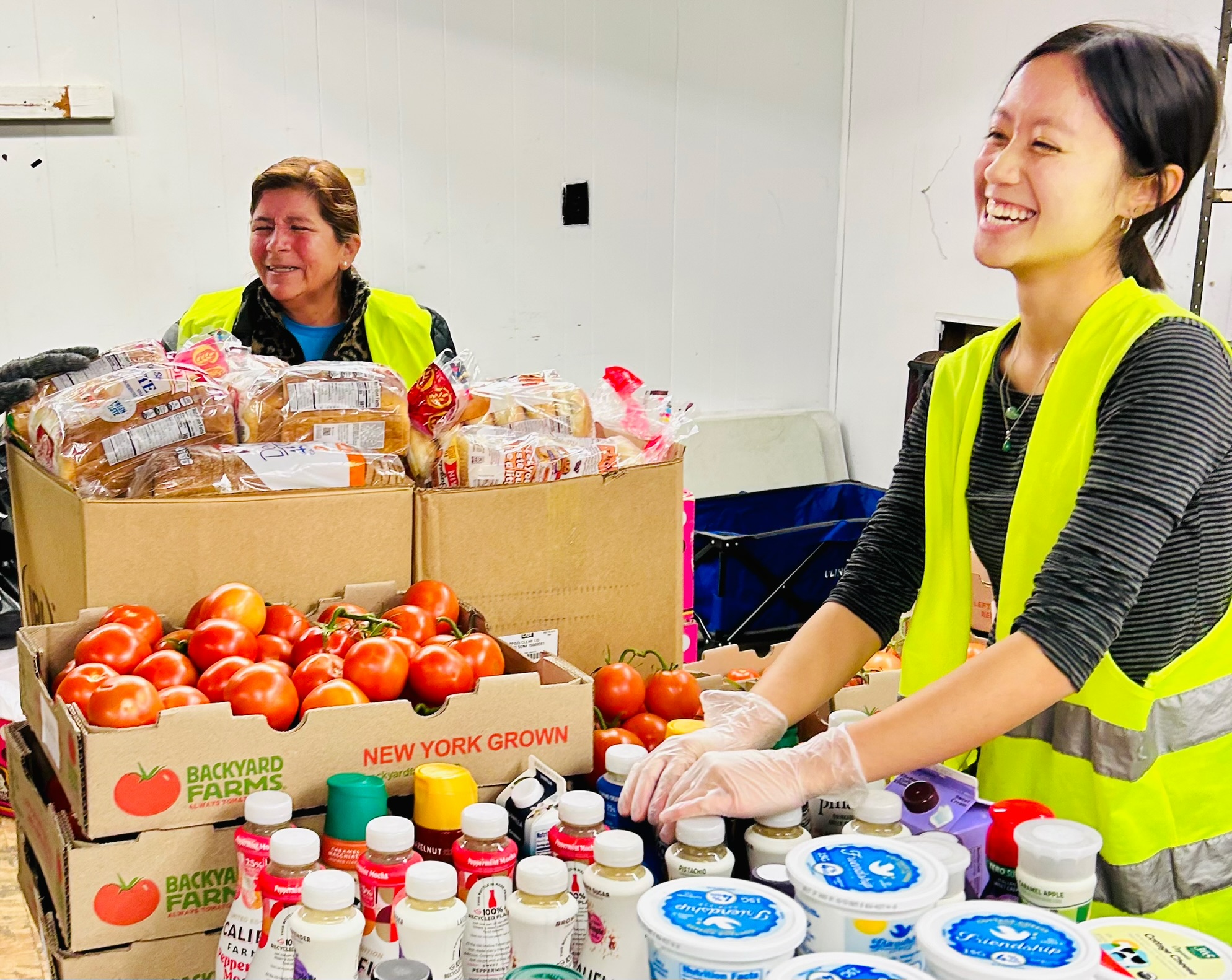 Smiling people working with food